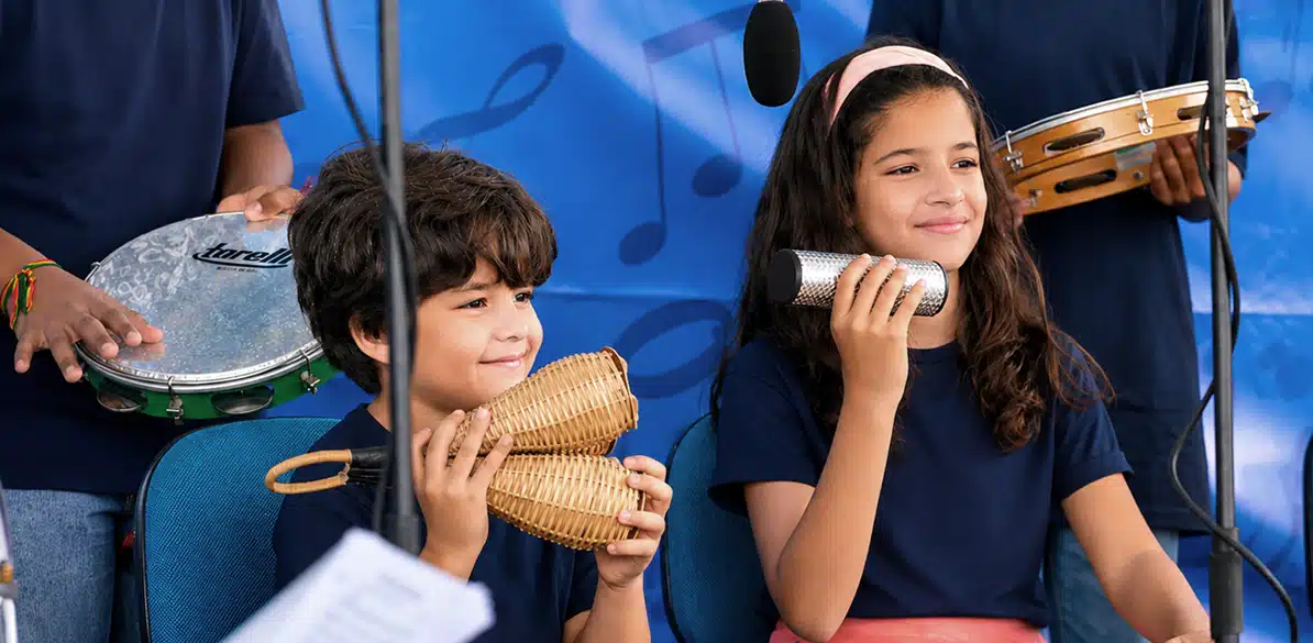Casa do Zezinho in Brazil helps young people gain access to higher education Children taking part in a musical activity at Casa do Zezinho in Brazil