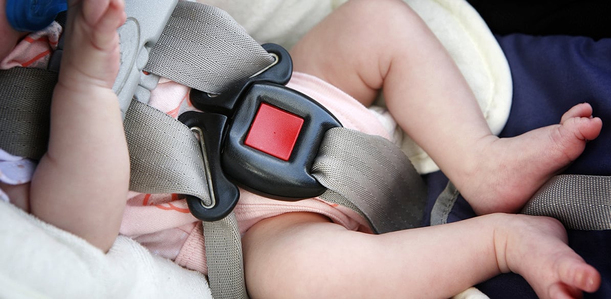 What difficulties do children with hypotonia have when travelling by car? 