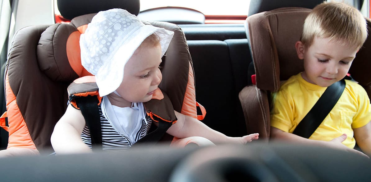 Will four children with their corresponding child seats fit in my car?