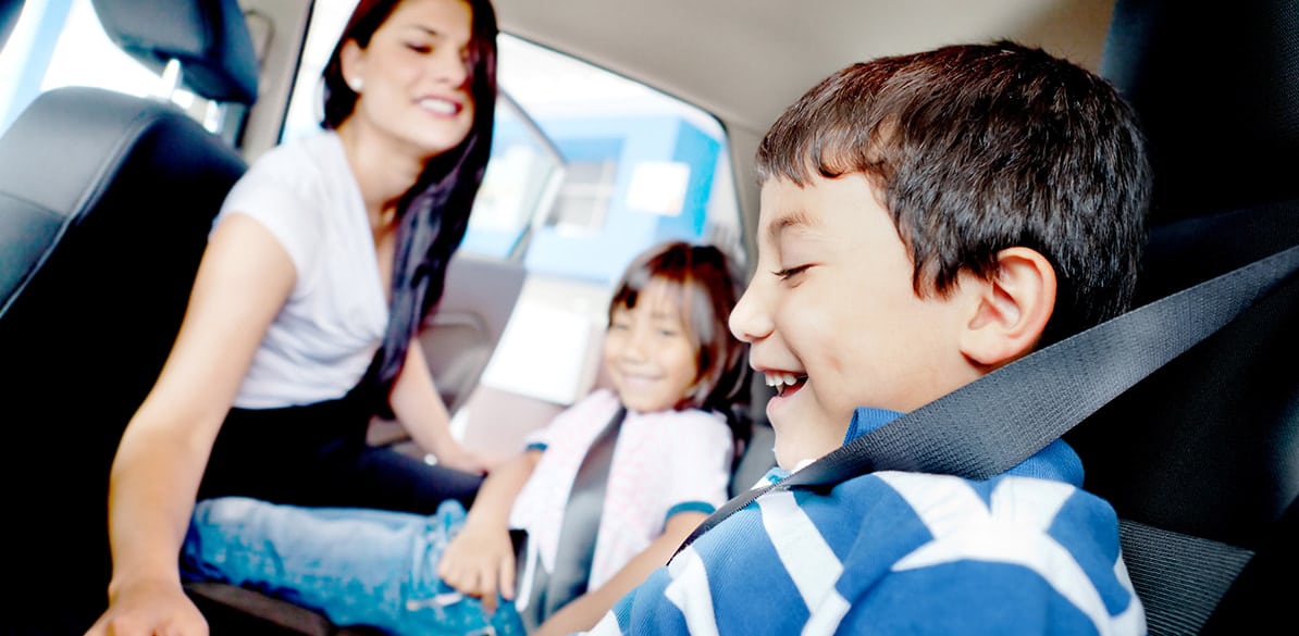 Children under 135 cm travel with child restraint systems in the rear seats (except in certain circumstances), and adults and those taller than 135 cm wearing a seat belt.