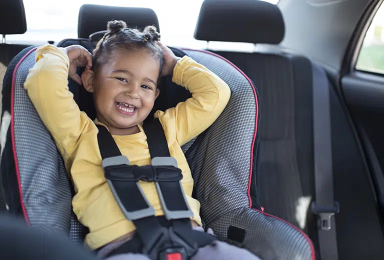 What is the safest seat for a child in a car?