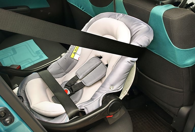 Why should children travel in rear-facing child car seats for as long as possible?