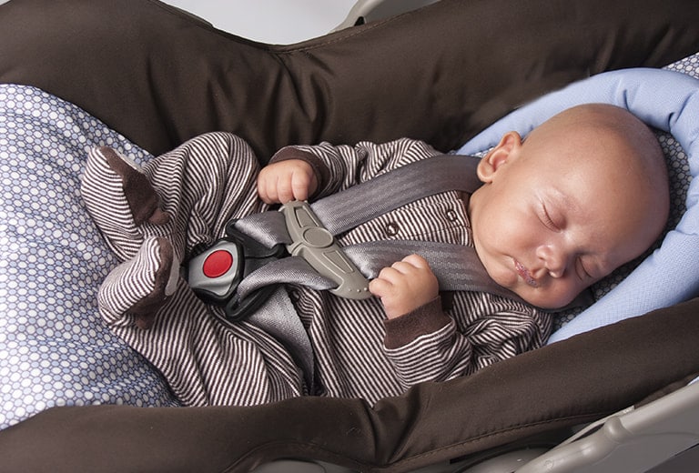 What should I do when traveling by car with a premature infant?