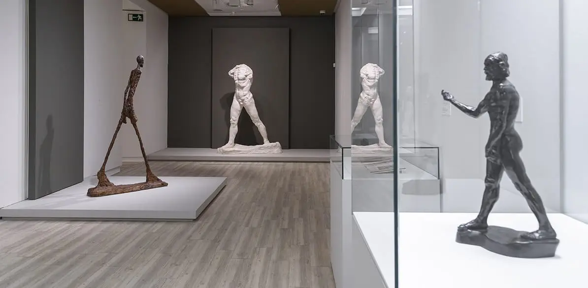 The Walking Man. Does it inspire you? Tell us how you feel about these twin works of art
