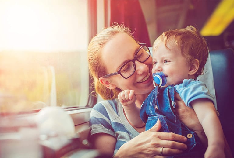 It is not possible to use the usual child restraint system used in cars because the train seats do not have seat belts.